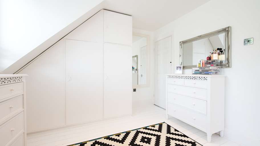 Bedroom with black and white rug 