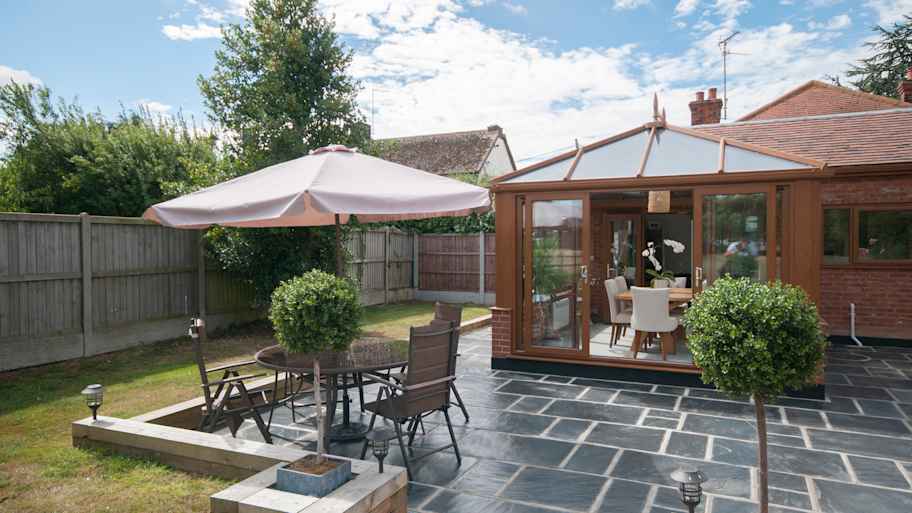 Spacious garden with a cozy patio