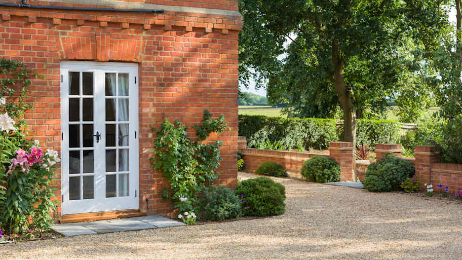 Brick house with outdoor French doors  