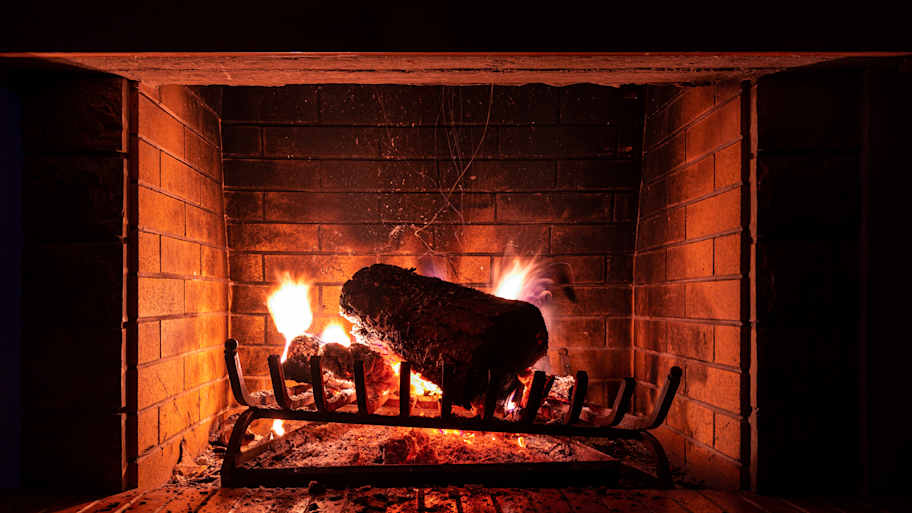 A log burning in a fireplace