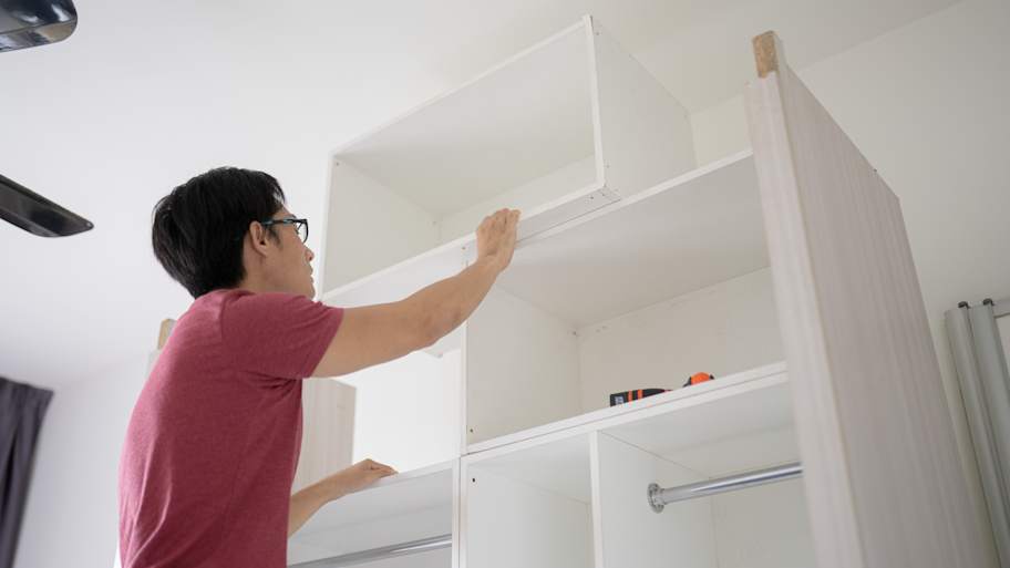 man assembling Wooden cabinet