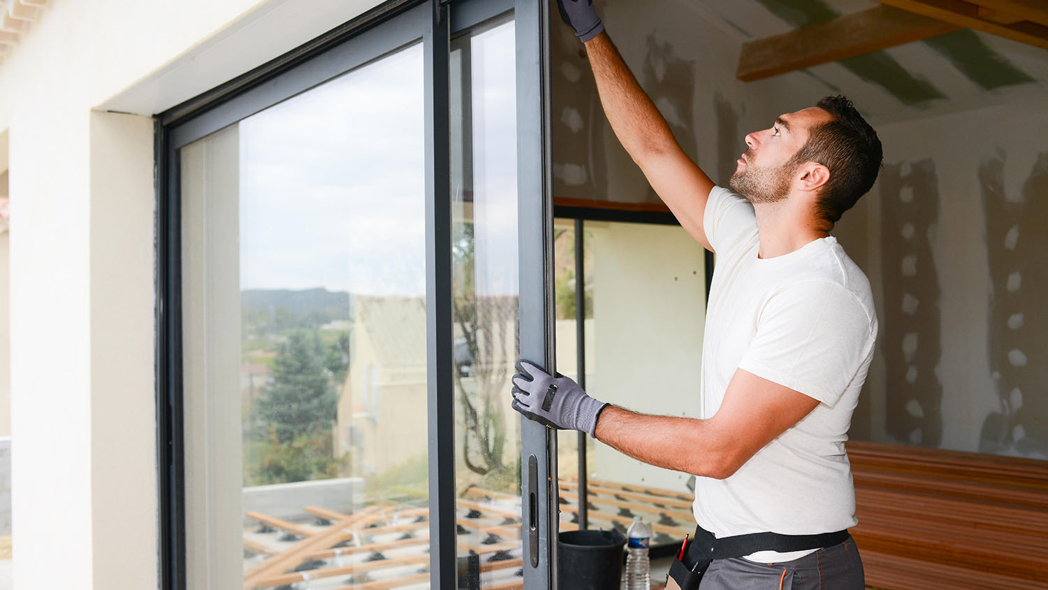 Person installing glass door