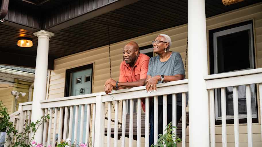 A senior couple relaxing on their porch