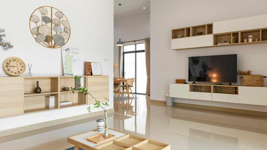 A modern living room with beige baseboards