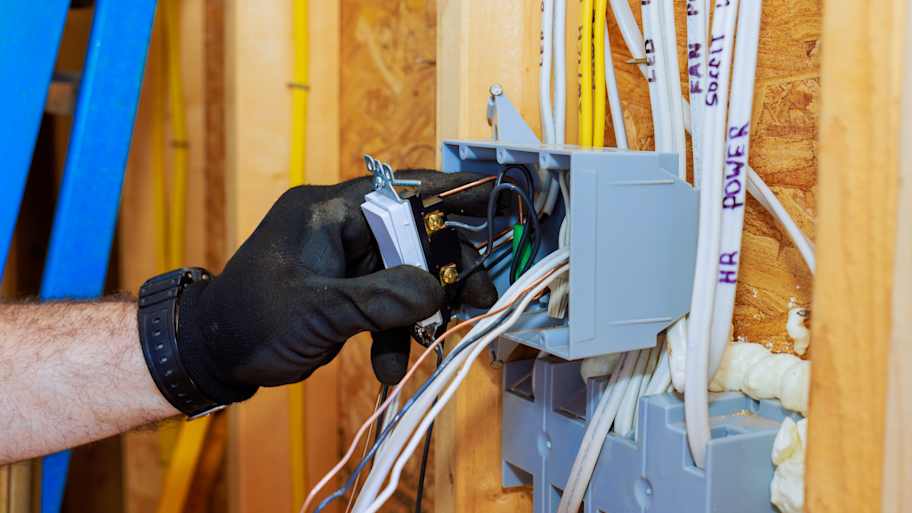 Electrician working on wiring connections