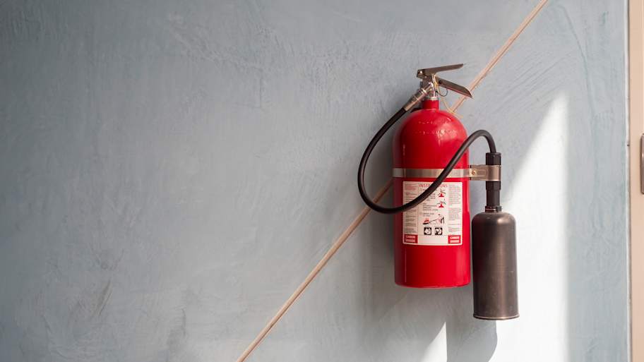 Fire extinguisher mounted on wall