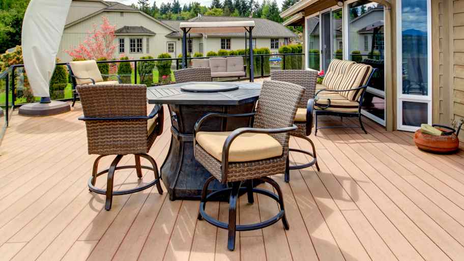 Large walkout deck with stained decking and patio furniture