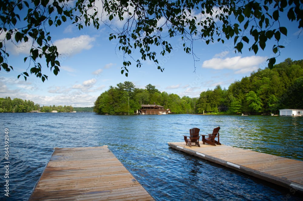 Adirondack chairs on a wooden dock