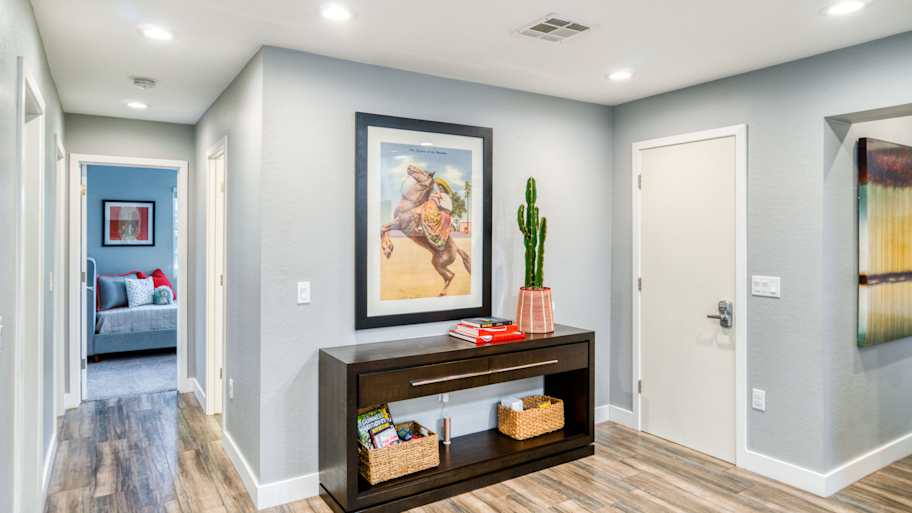 hallway with large picture above table