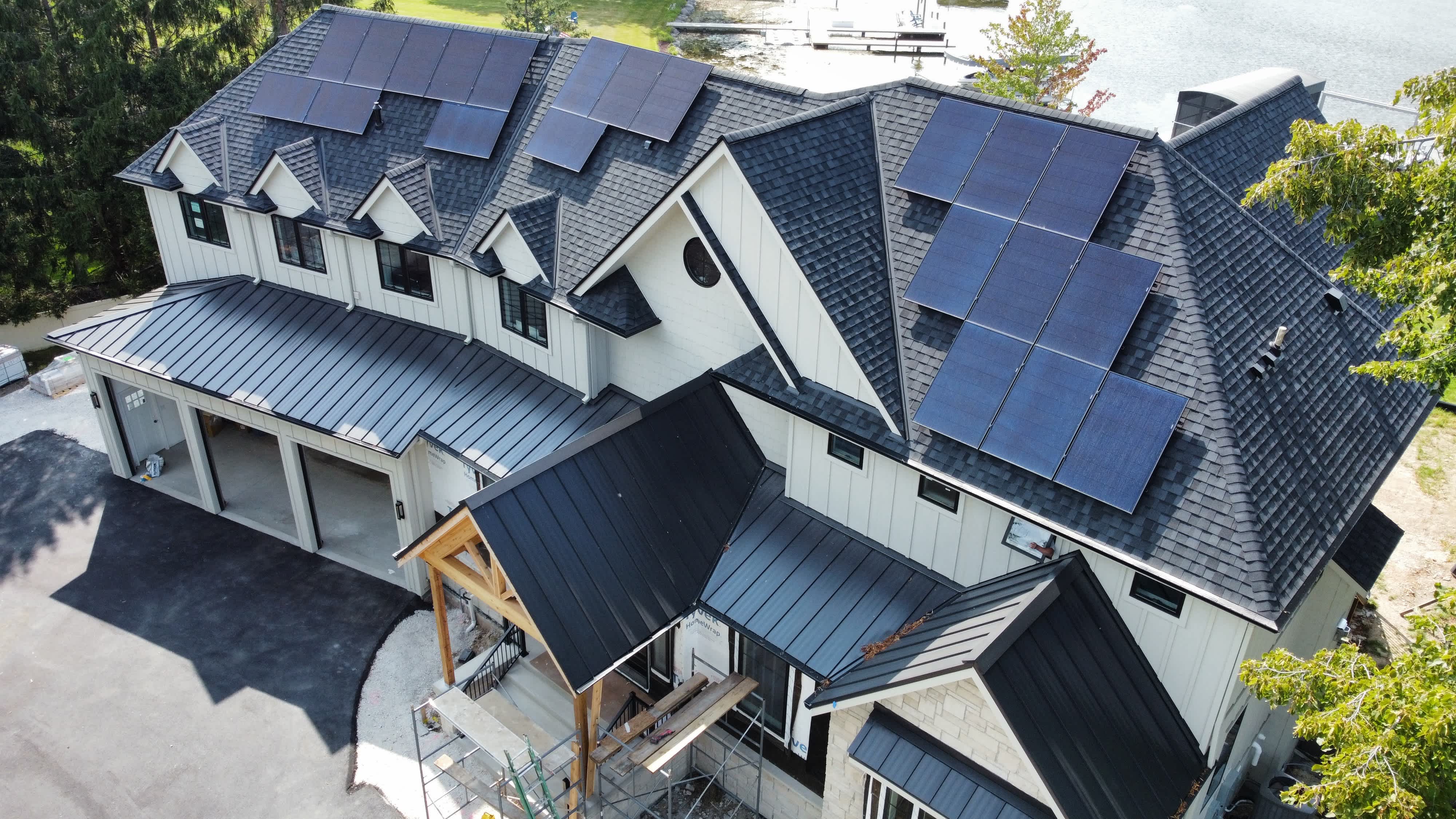 Luxury home with solar panels on roof