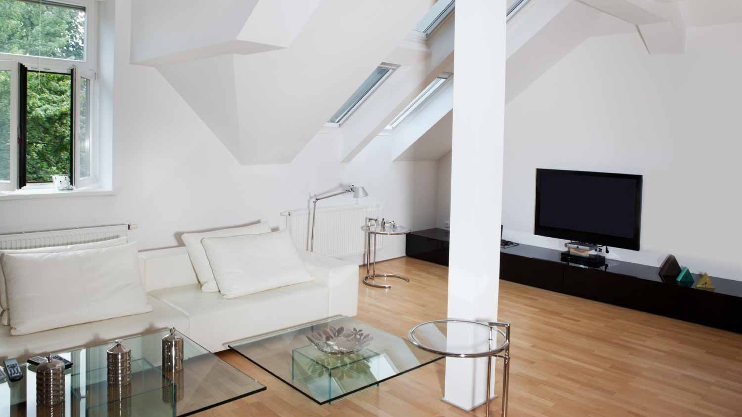 Attic living room with a tv