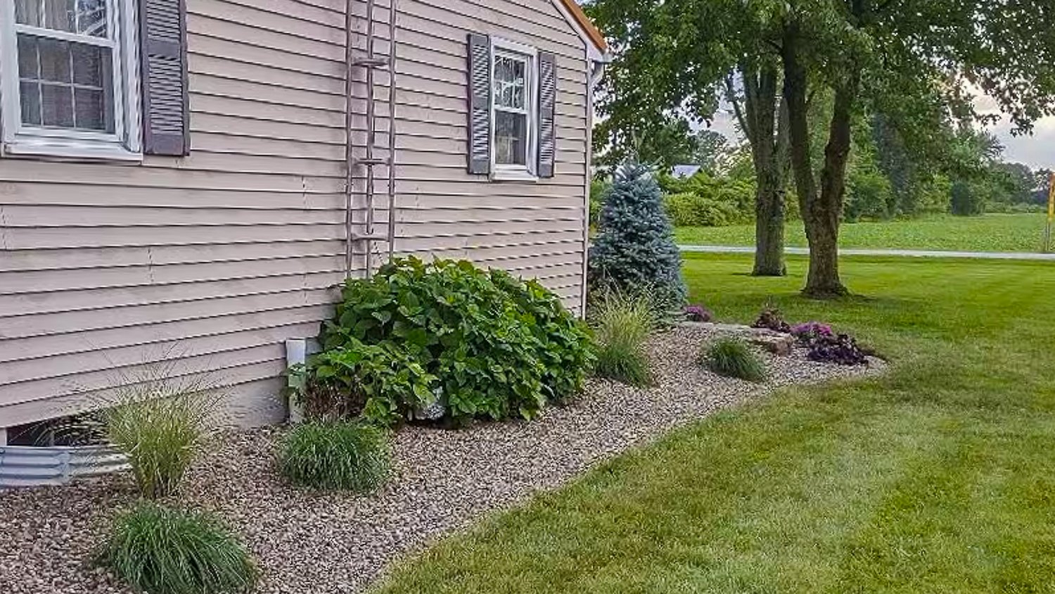 Back of a house with rock landscaping