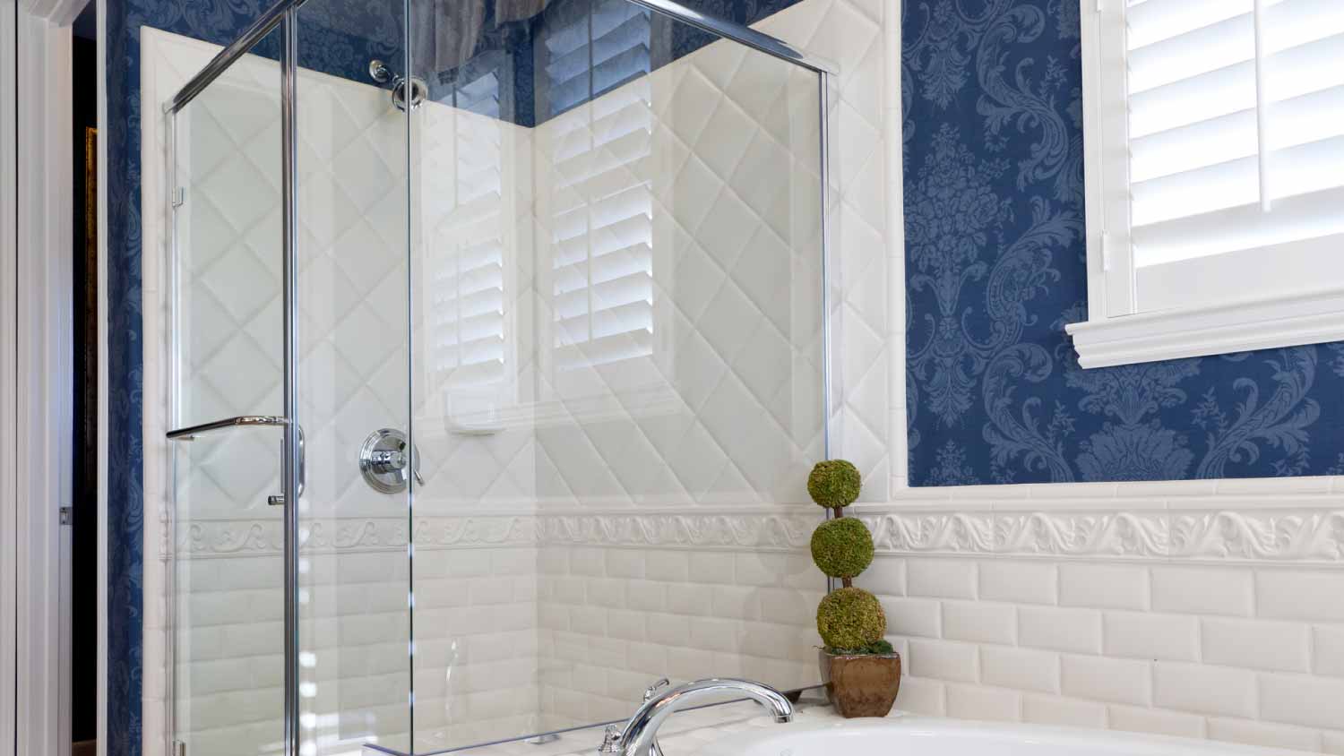 Bathroom with blue wallpaper