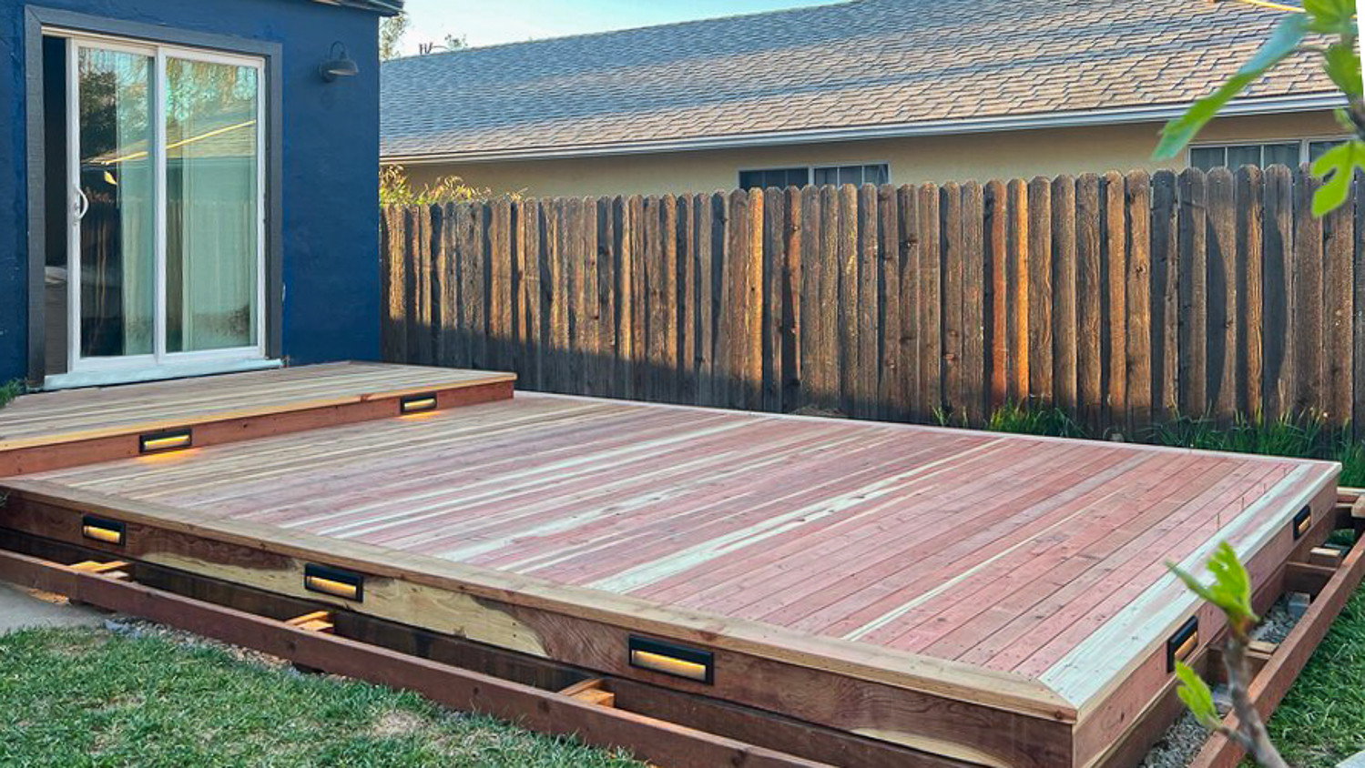 Blue house with wooden deck 