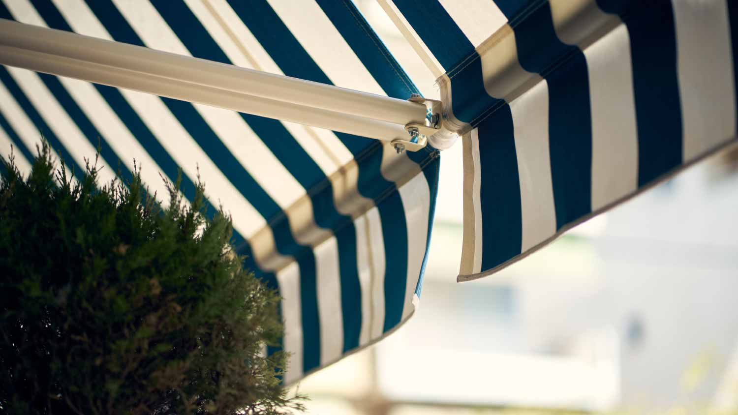 Blue and white retractable awning