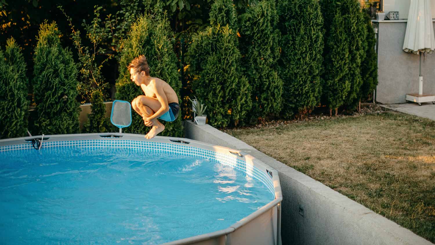 Boy playing in swimming pool