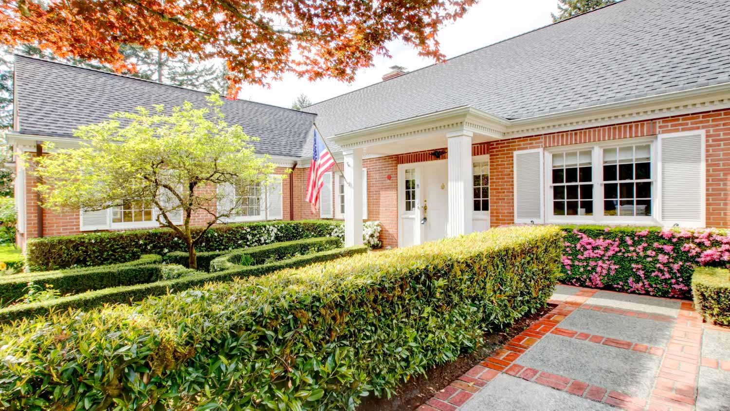 Brick house with white shutters