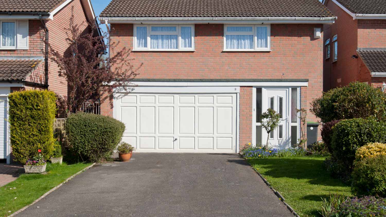 Brick house with driveway asphalt