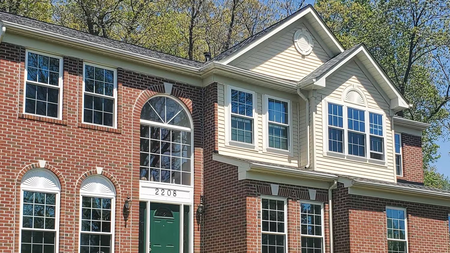 Brick house with a lot a windows 