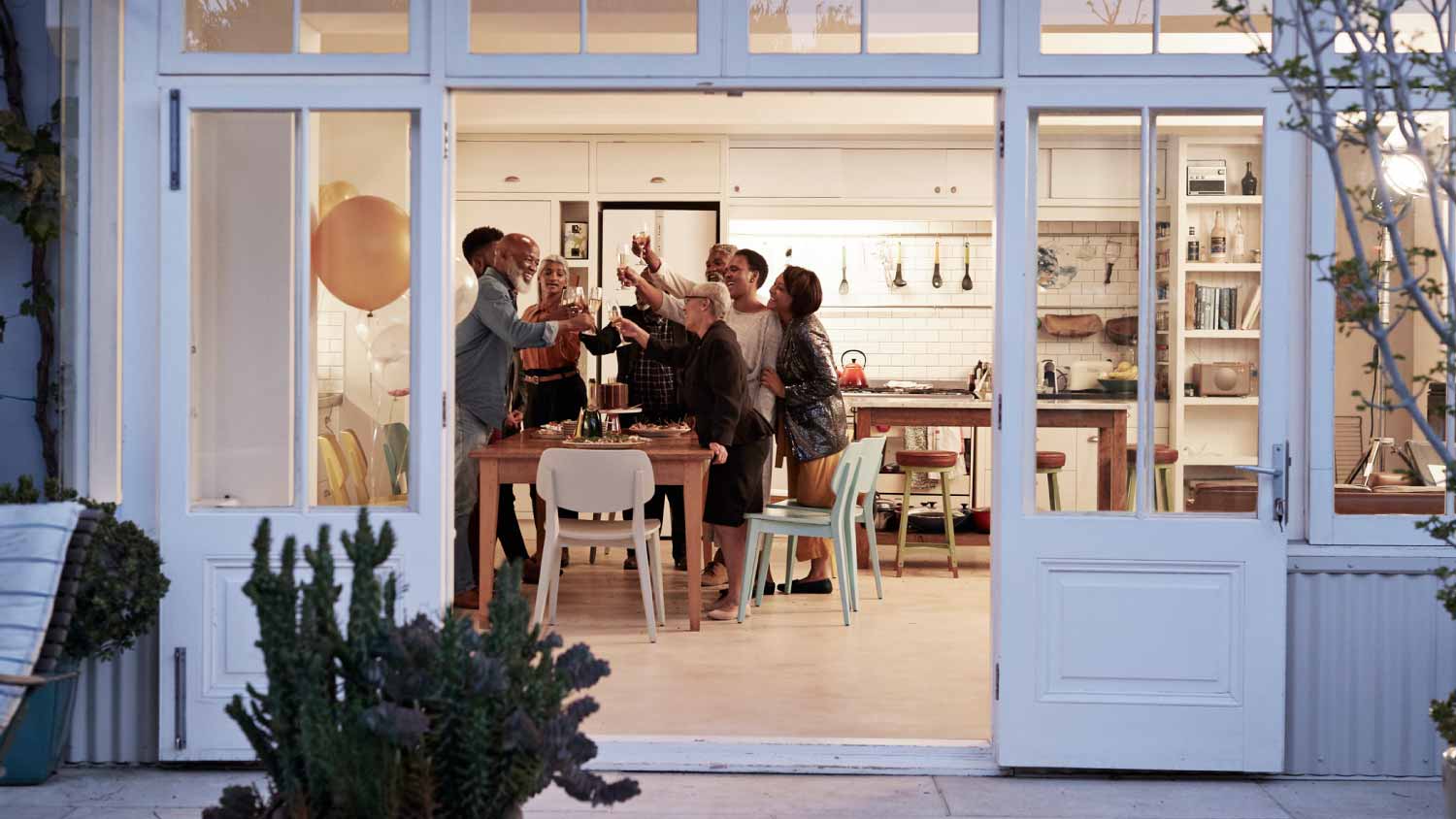 Cheerful family toasting drinks