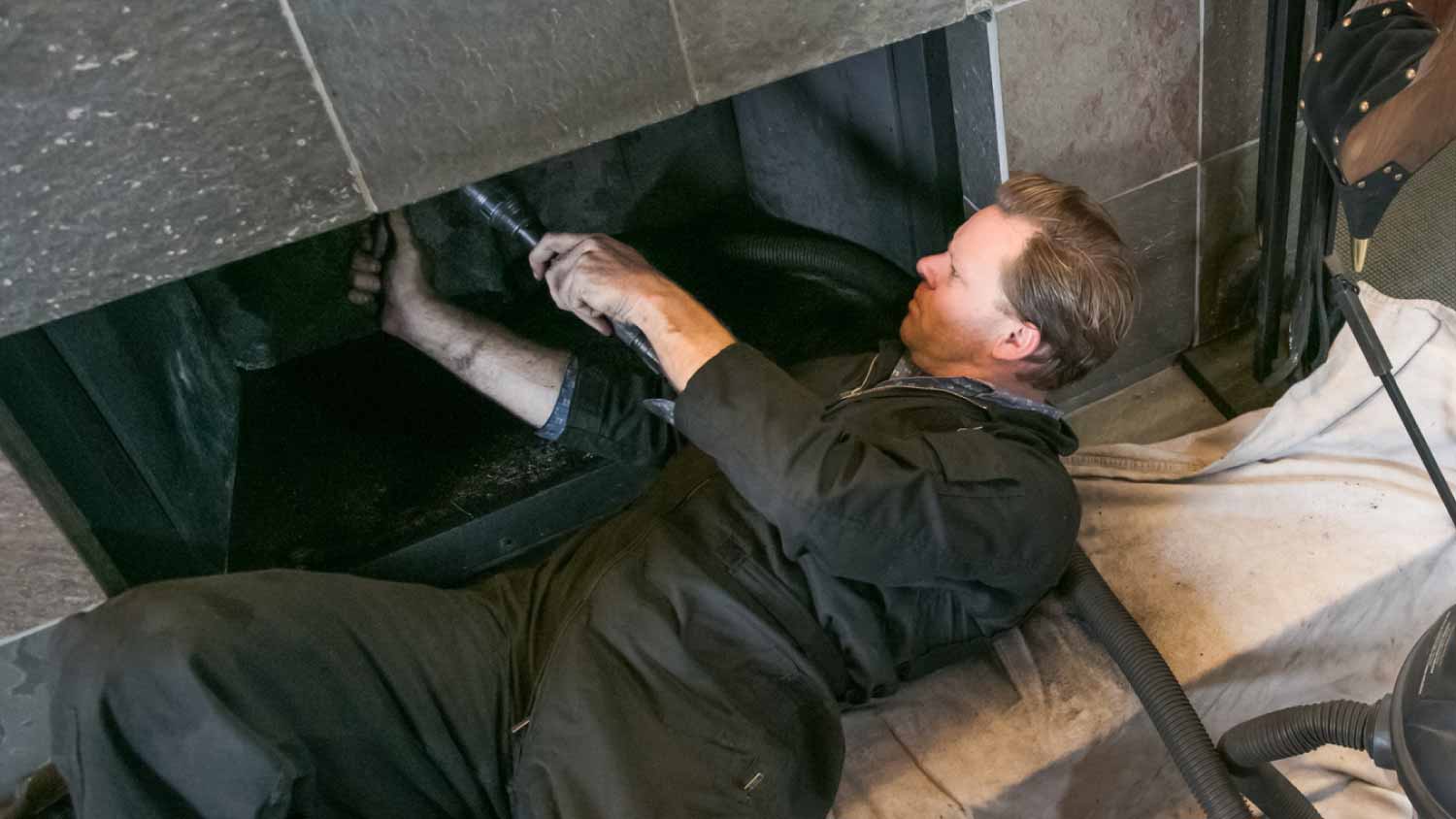 Chimney Sweep cleaning fireplace