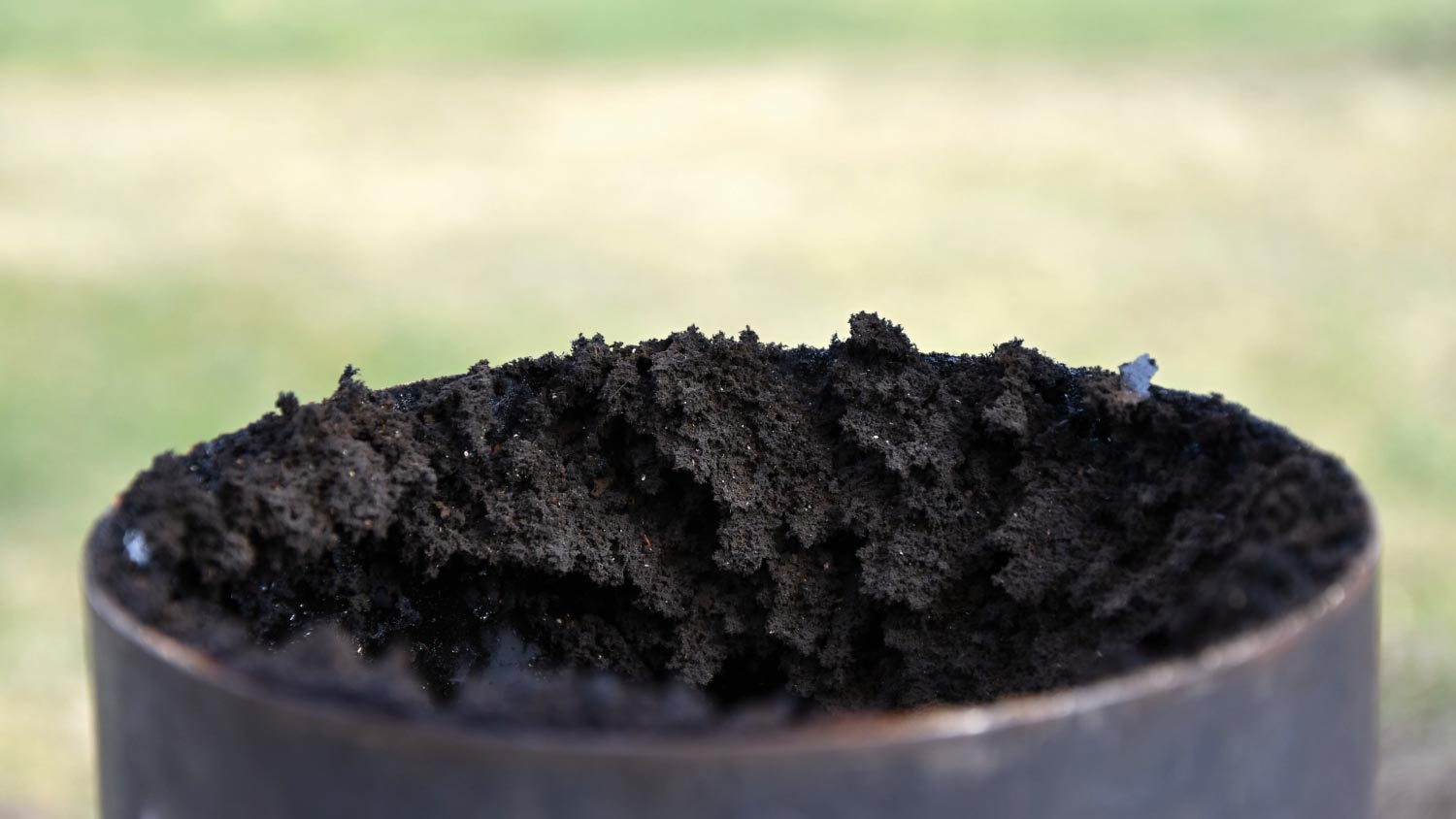 A chimney flue pipe covered with a thick layer of soot