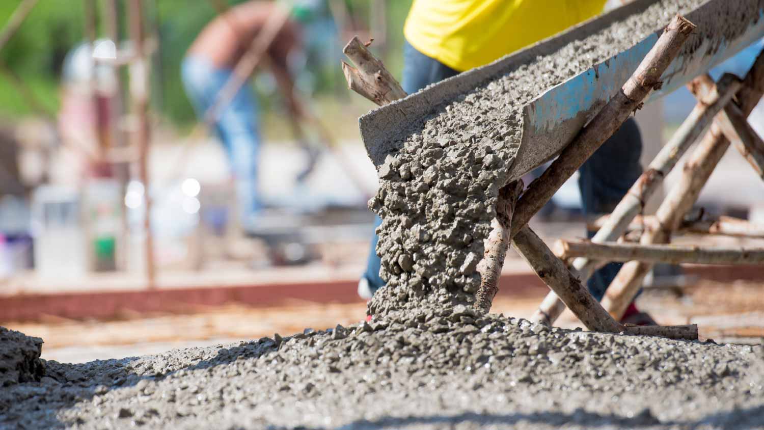 Man pouring cement for a footer