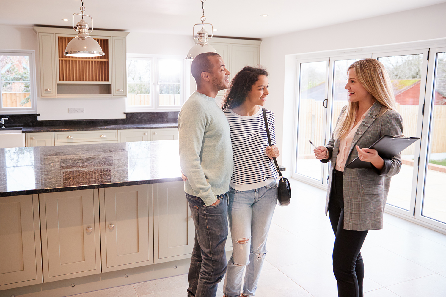 Realtor showing couple a house for sale