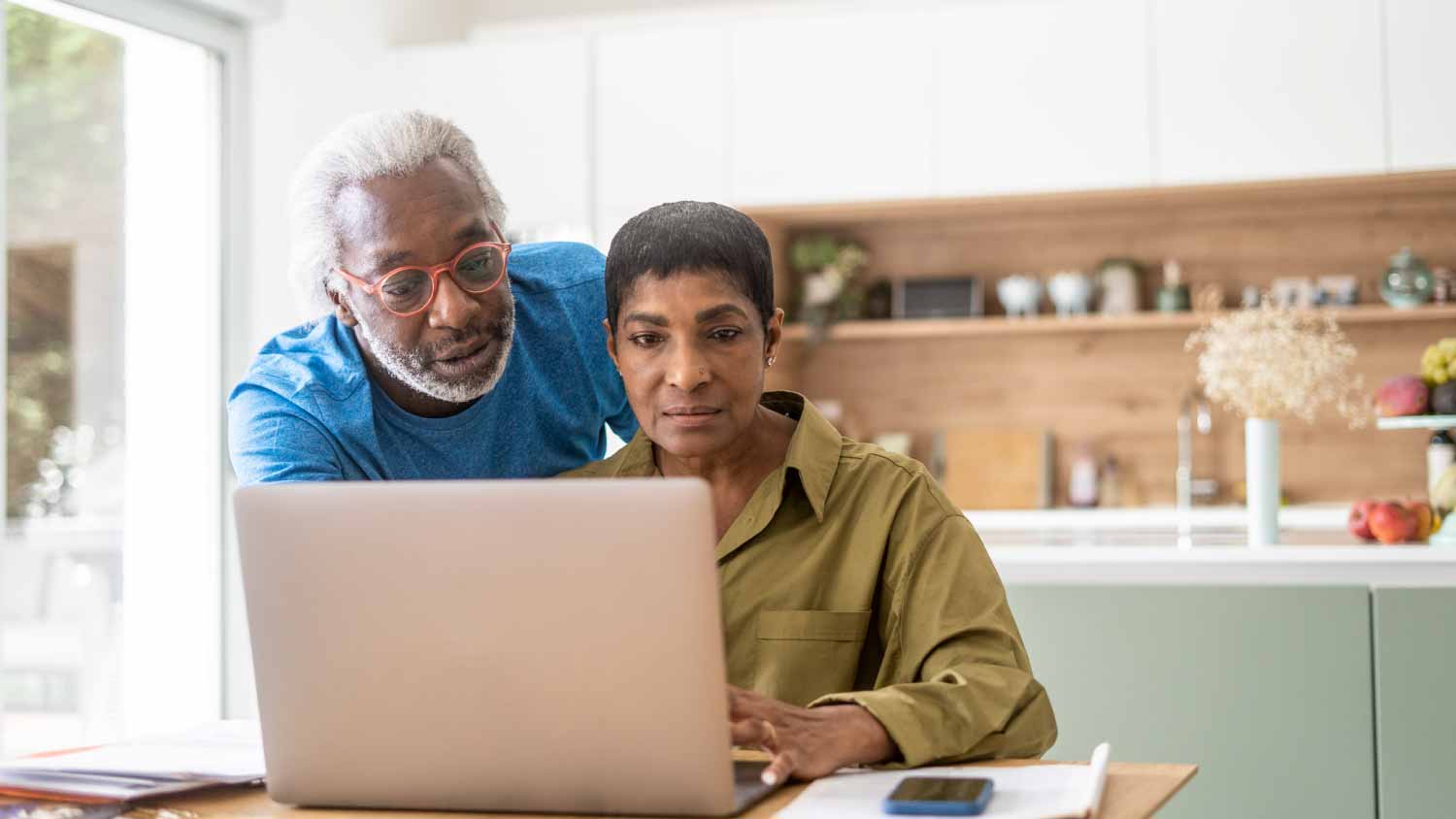 Couple looking at a laptop