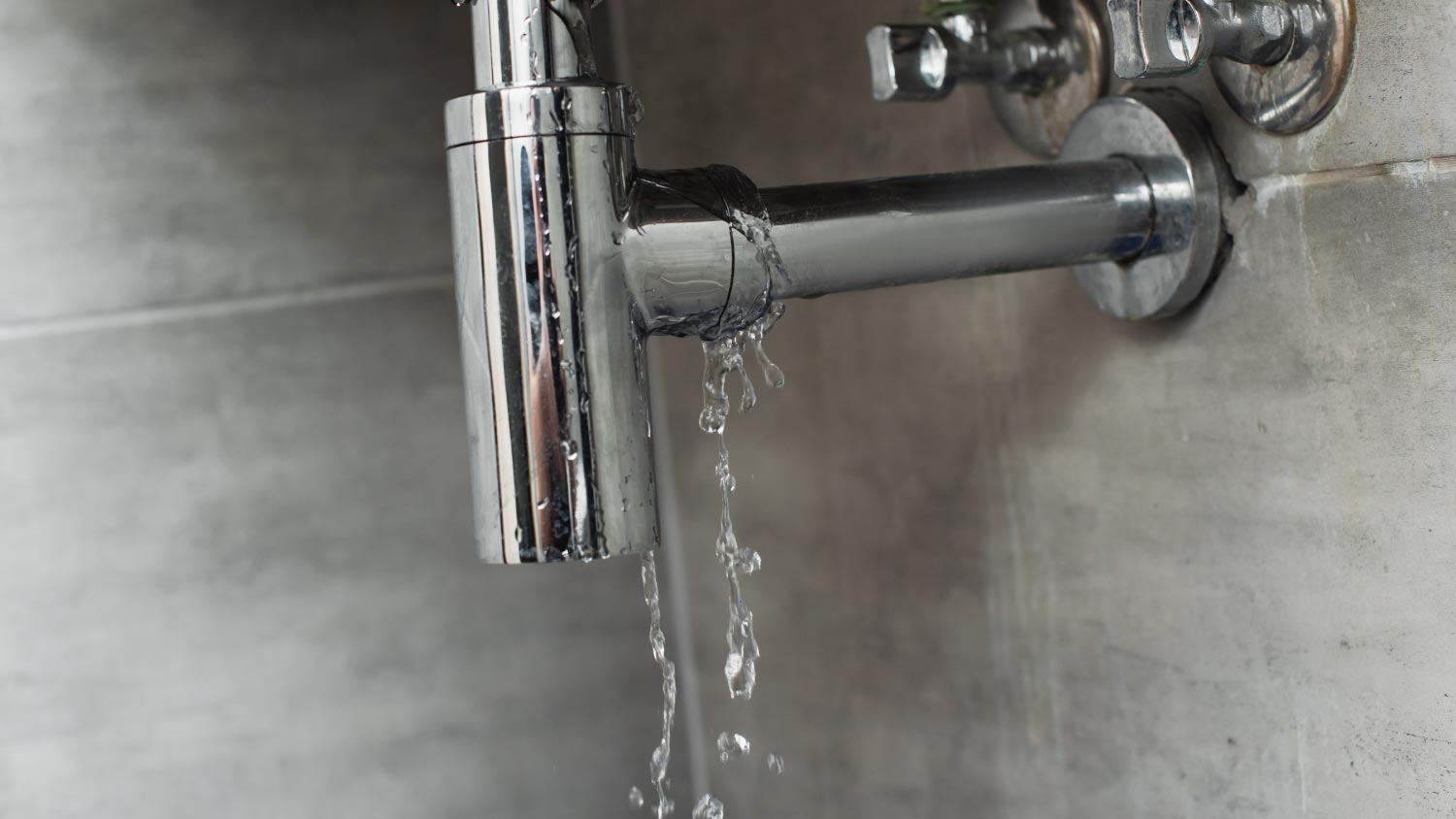 Damaged pipe with leaking water