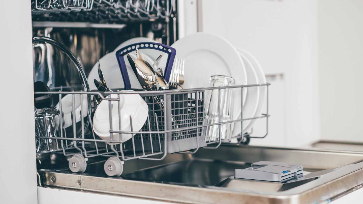 Dishwasher in kitchen with clean dishes