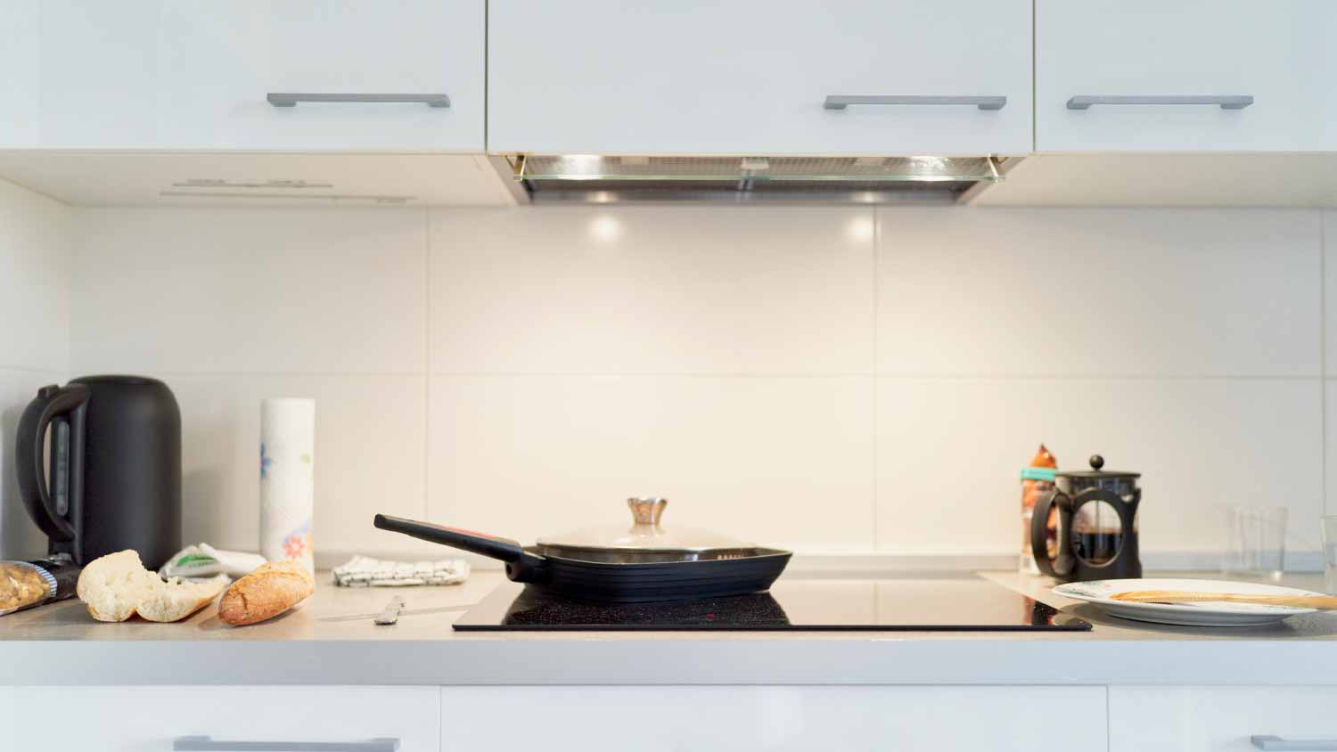 Electric stove with a black frying pan