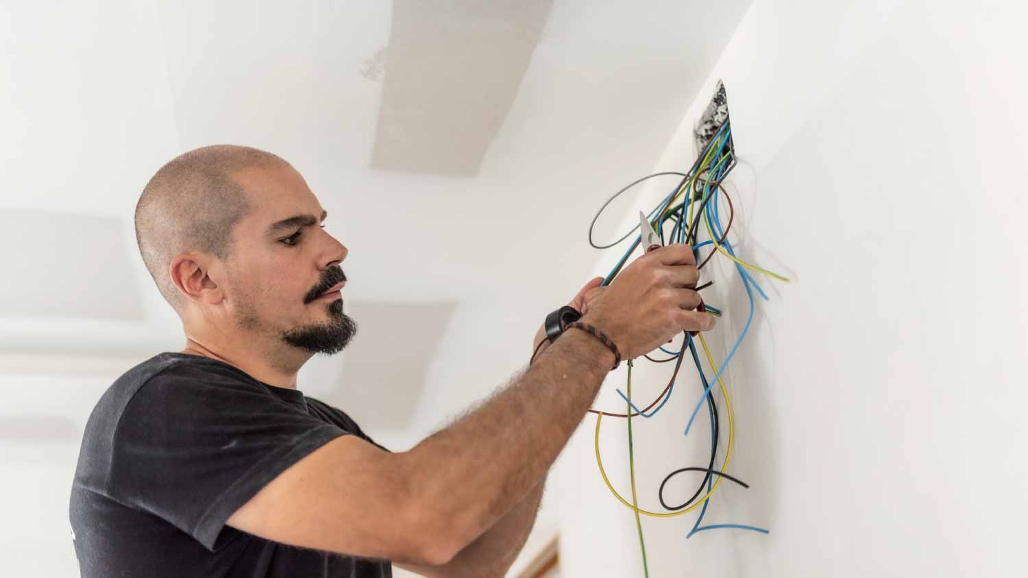 Electrician checking circuit and cables 