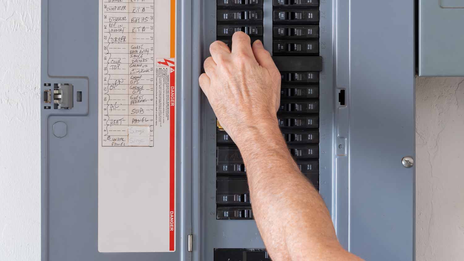 Electrician turning off power for electrical outlet