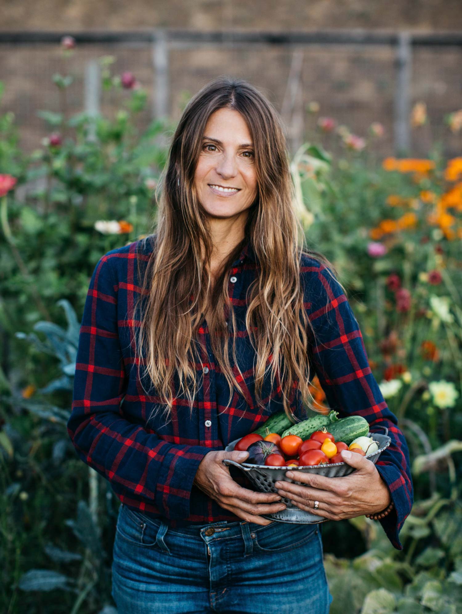 Woman holding a bowl of vegetables