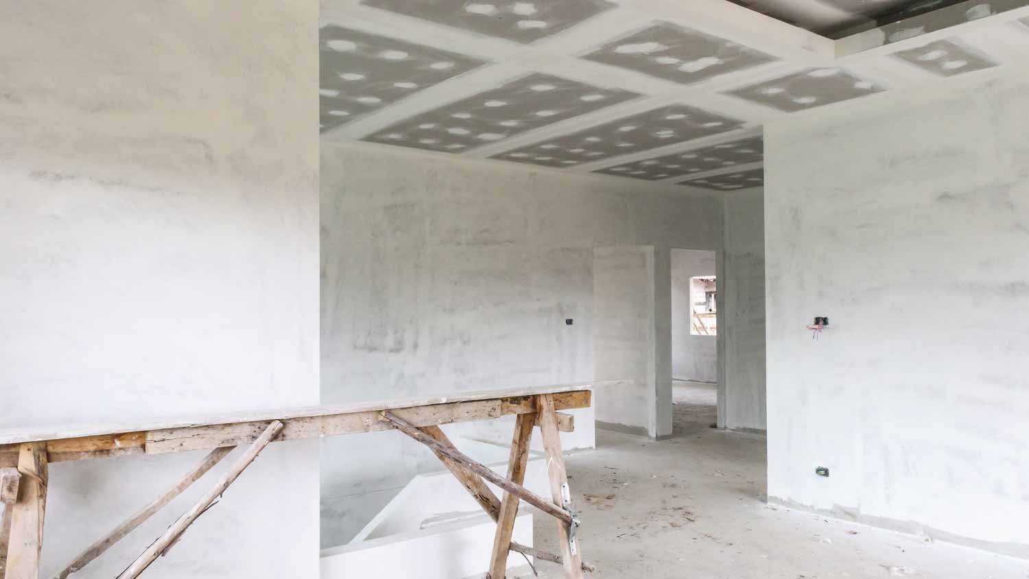 Empty room interior with gypsum board ceiling