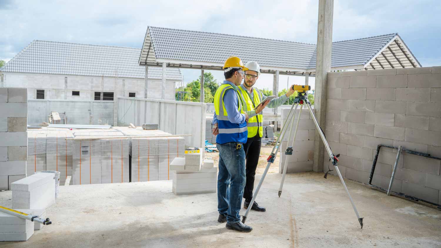 Engineers using a theodolite