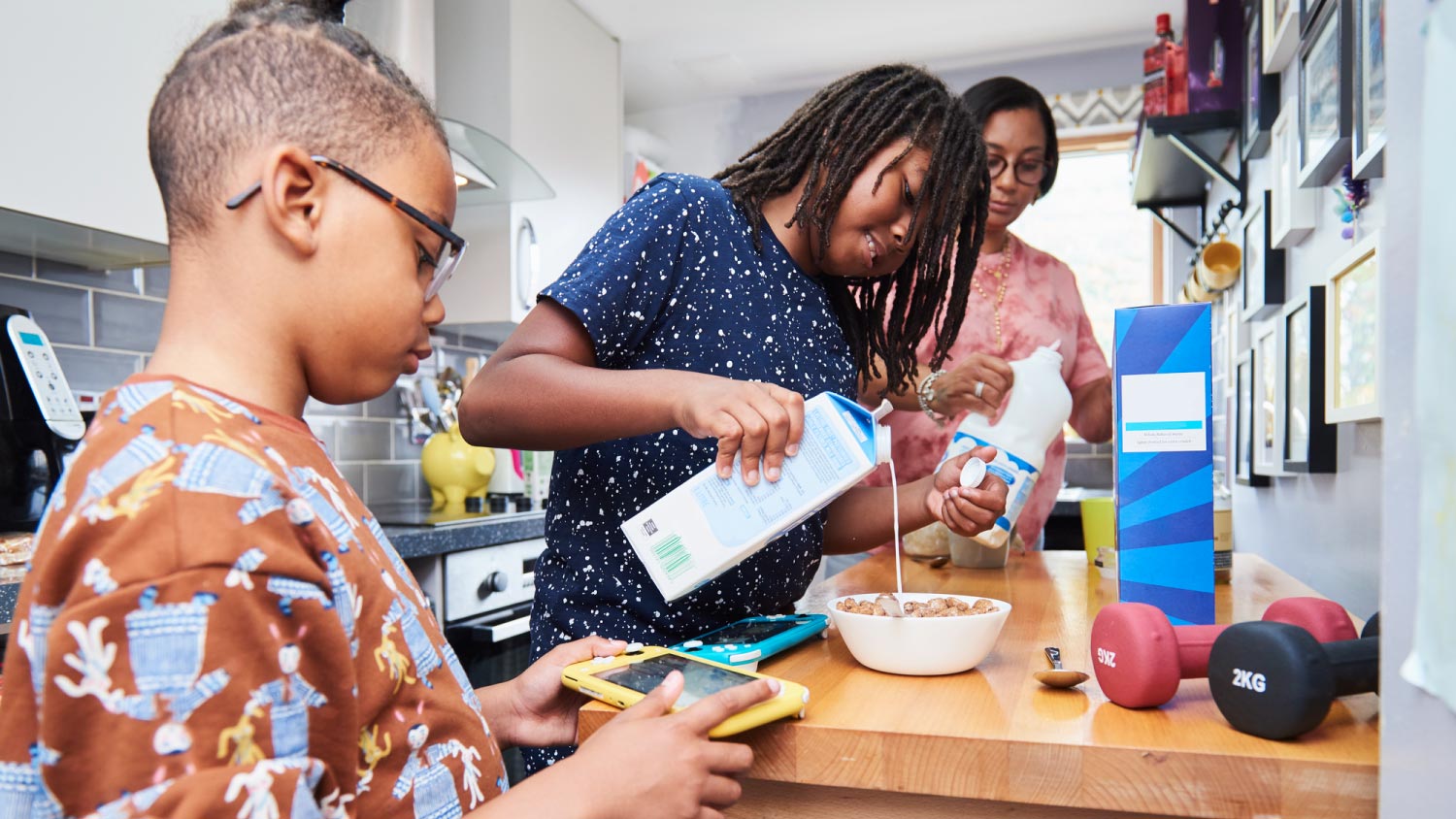 Family preparing breakfast in kitchen