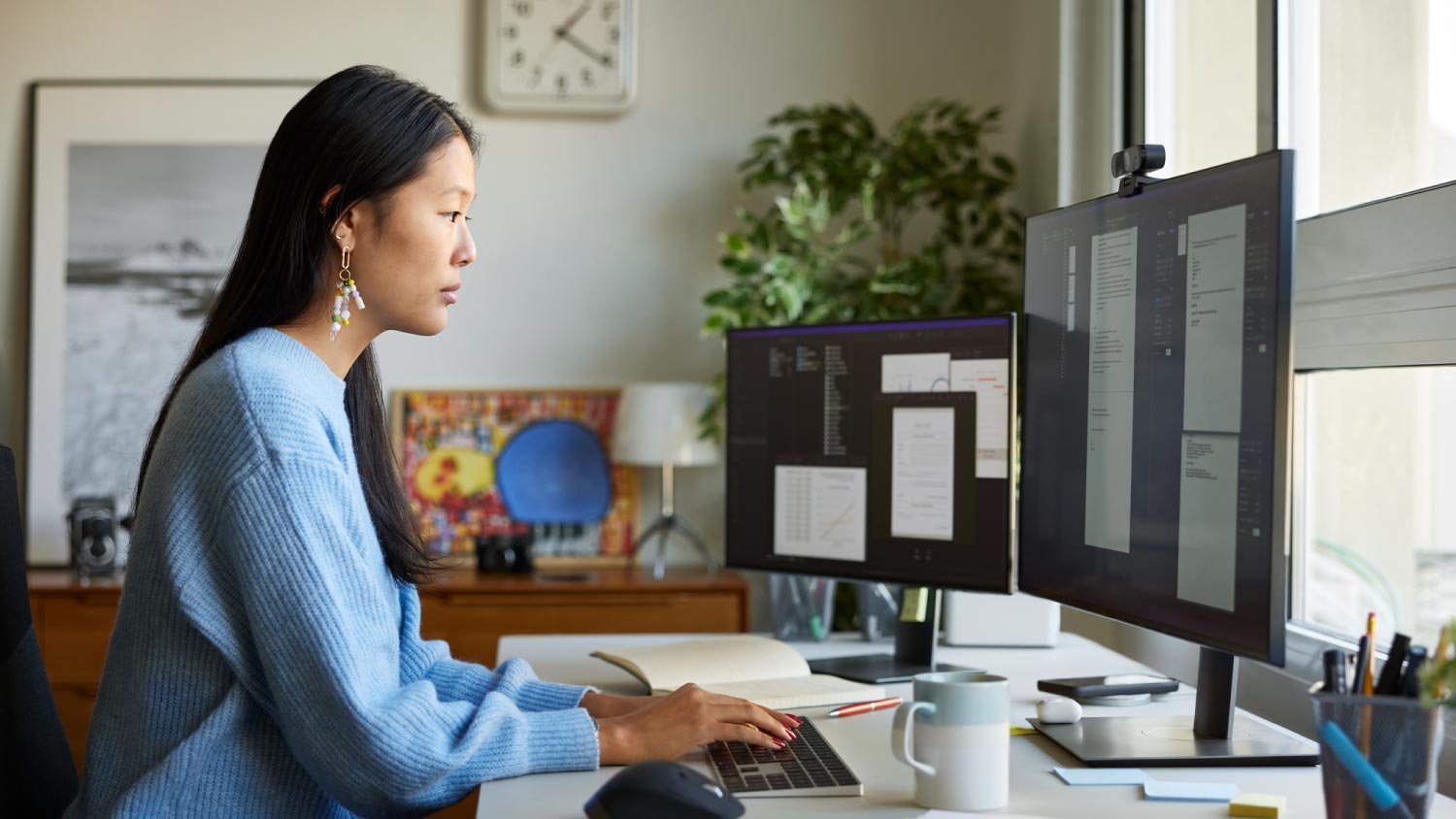 Female entrepreneur using computer at home office