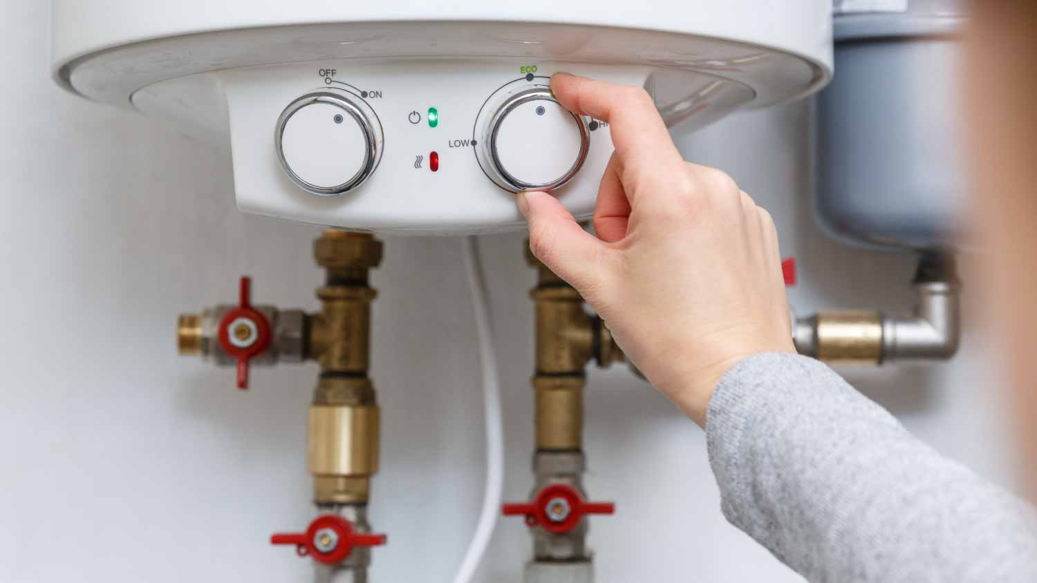 Female turning on electric water heater