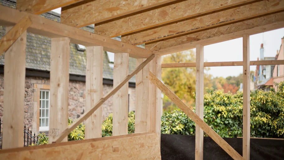 Shed with unfinished plywood wall sheathing