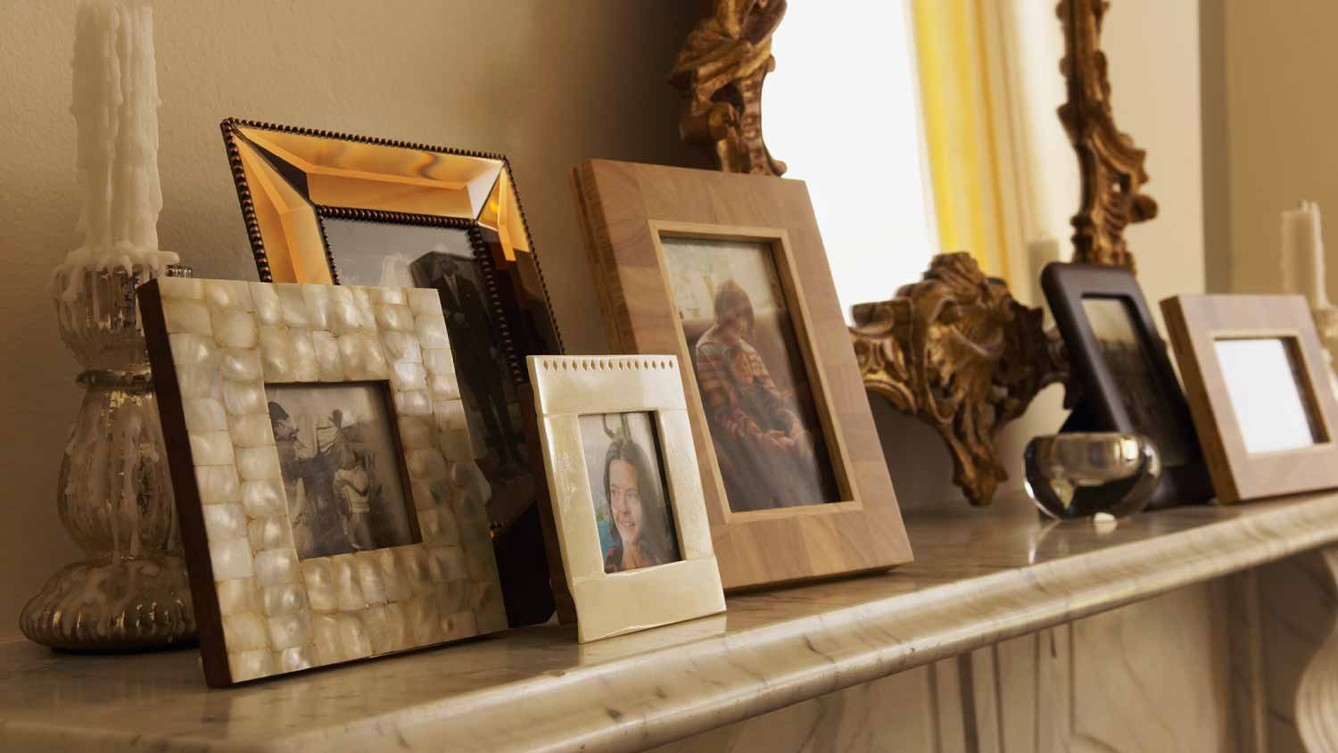 Fireplace with framed pictures