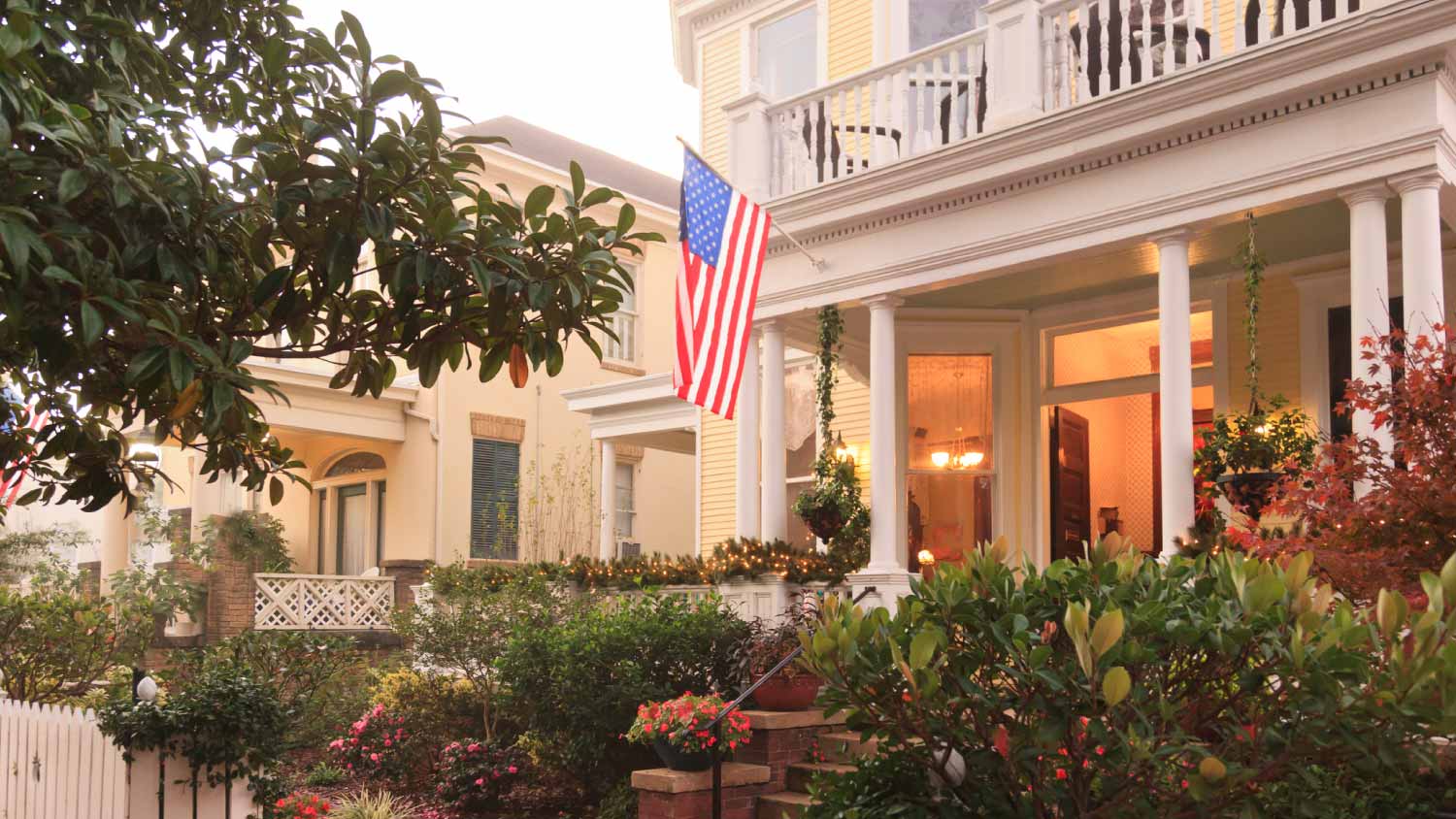 Front Porch and gardens with American Flag