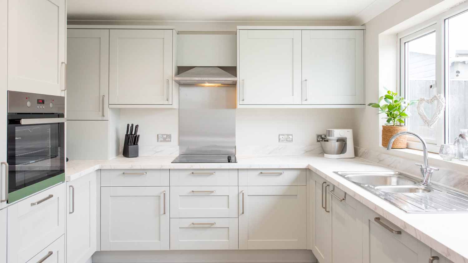 General view of a white kitchen 