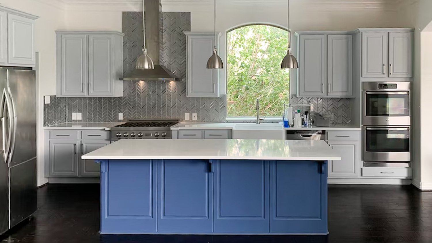 Gray kitchen with blue island 