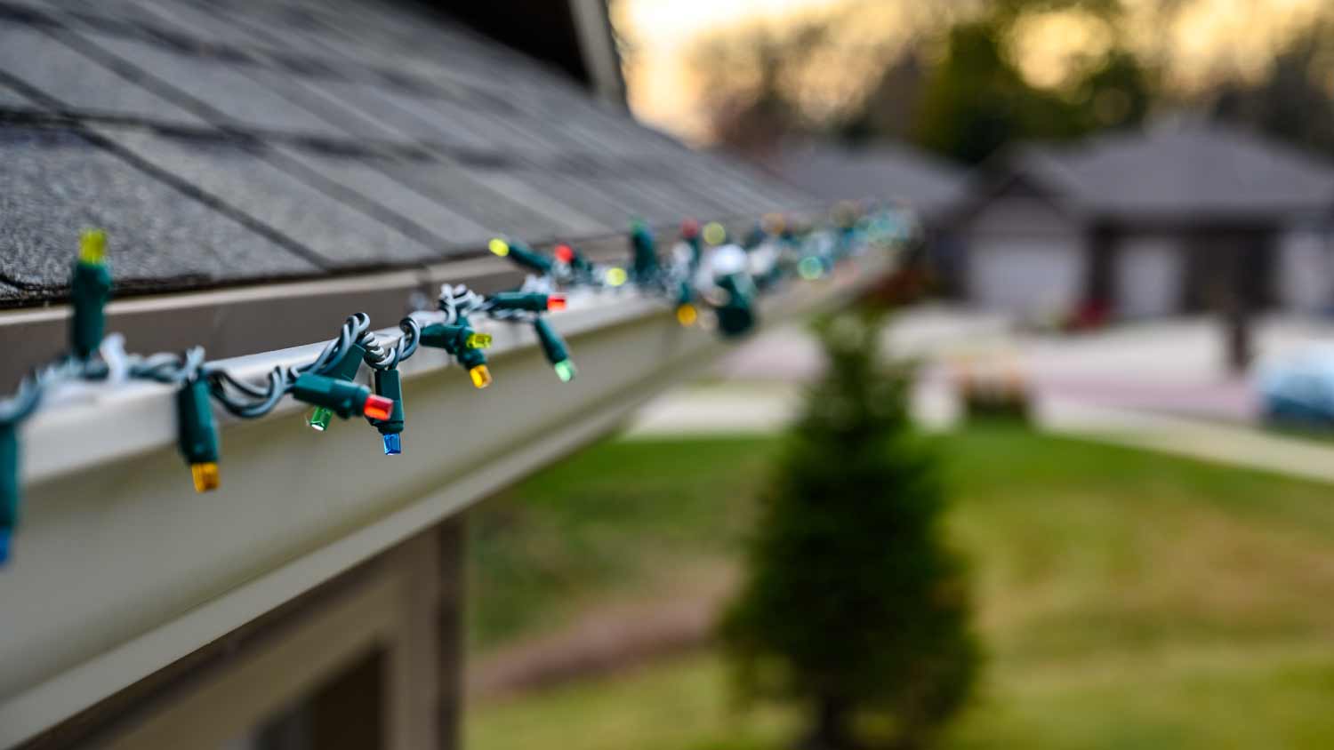 Hanging Christmas lights on gutter edge