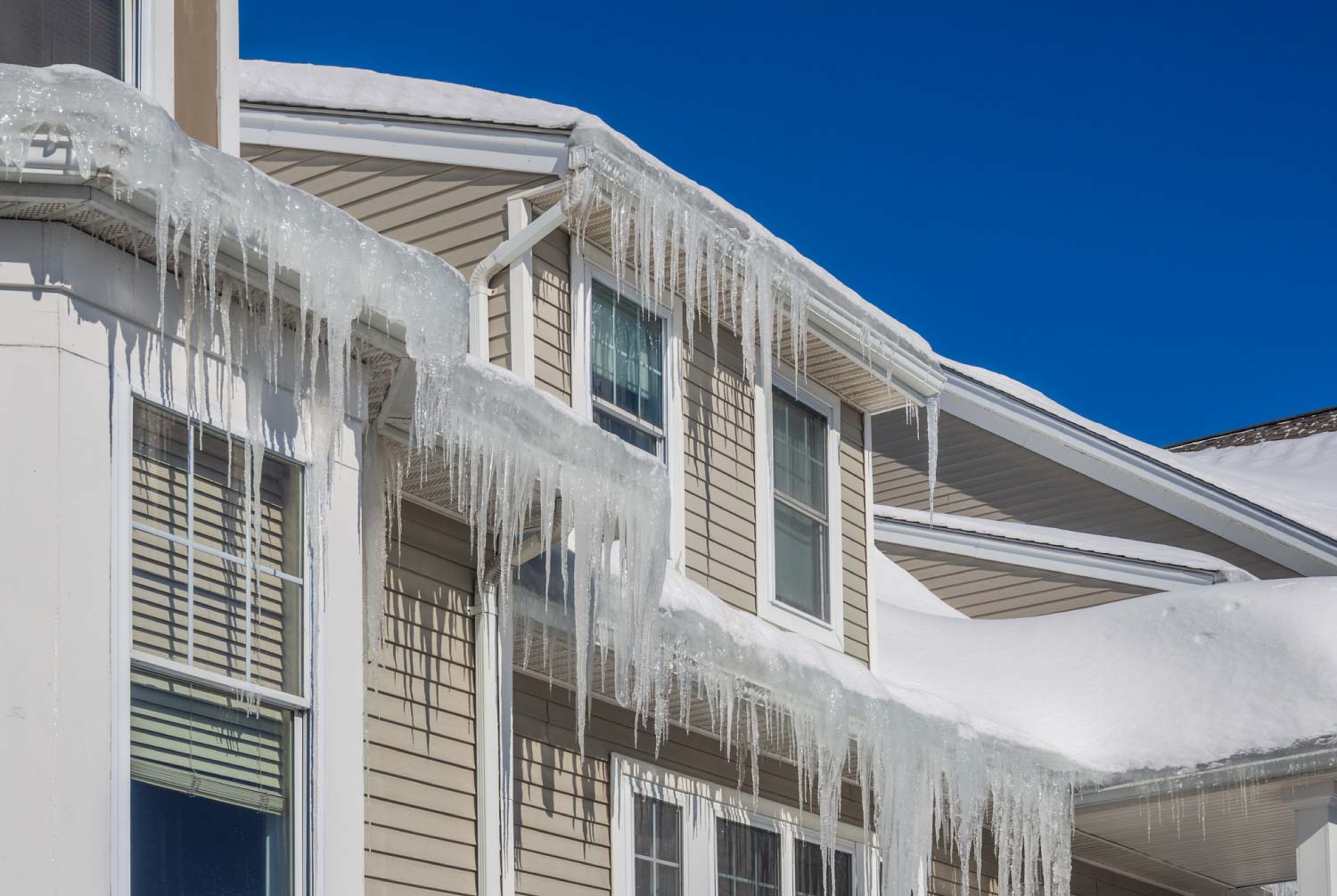 Ice dams and snow on roof and gutters