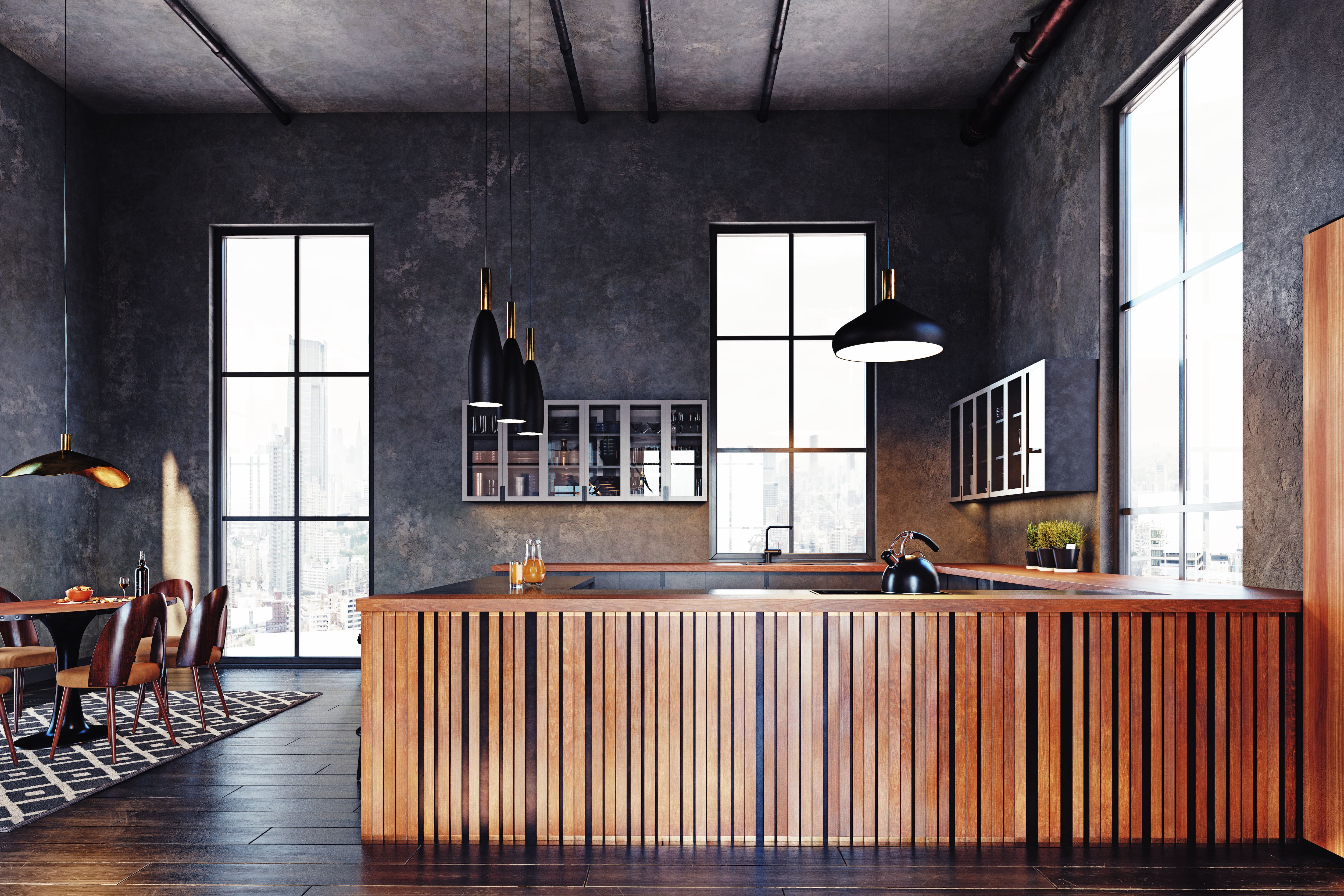 Loft kitchen and dining room with charcoal walls, bamboo and wood slat countertops, and black pendant lights