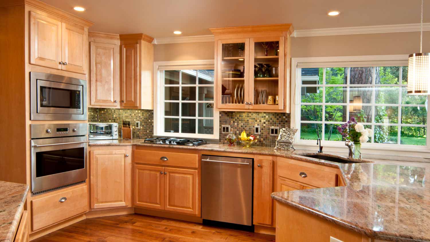 Kitchen with hardwood floors and cabinets