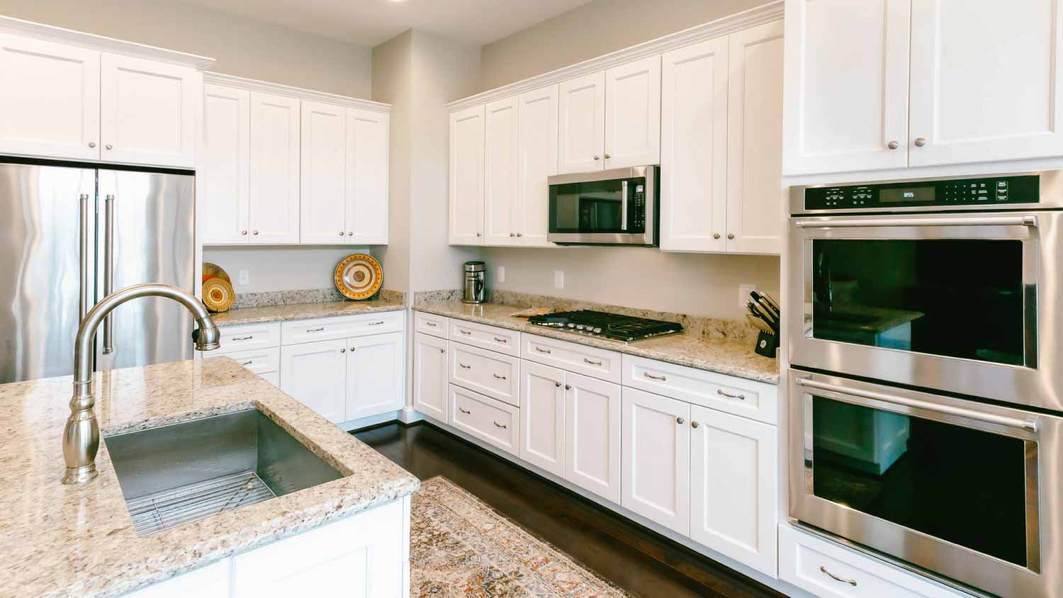 Kitchen with light granite countertops